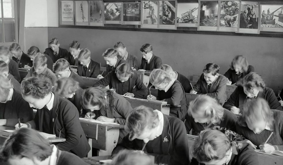 school children in class sitting at desks