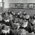 school children in class sitting at desks
